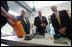 Vice President Dick Cheney, Senator Saxby Chambliss, and Department of Homeland Security Secretary Michael Chertoff are shown various types of radioactive sensing devices during a visit to the Federal Law Enforcement Training Center in Glynco, Georgia, May 2, 2005.