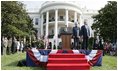 President Bush stands with India's Prime Minister Dr. Manmohan Singh, Monday, July 18, 2005 during the playing of the national anthems on the South Lawn of the White House. 