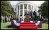 President Bush stands with India's Prime Minister Dr. Manmohan Singh, Monday, July 18, 2005 during the playing of the national anthems on the South Lawn of the White House. 