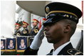 A member of the 3rd U.S. Infantry Old Guard Ceremonial Unit salutes Monday, July 18, 2005, at the arrival ceremony for India's Prime Minister Dr. Manmohan Singh, on the South Lawn of the White House. 