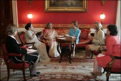 Laura Bush and Mrs. Gursharan Kaur, wife of India's Prime Minister Dr. Manmohan Singh, meet for coffee Monday, July 18, 2005, during an official visit to the White House. 