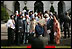 President George W. Bush reviews an honor guard with India's Prime Minister Dr. Manmohan Singh, Monday, July 18, 2005, on the South Lawn of the White House, during Singh's official arrival ceremony. 