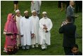 Invited guest attending the official arrival of India's Prime Minister Dr. Manmohan Singh, pose Monday, July 18, 2005, for a photo on the South Lawn of the White House. 