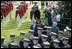 President George W. Bush reviews an honor guard with India's Prime Minister Dr. Manmohan Singh, Monday, July 18, 2005, on the South Lawn of the White House, during Singh's official arrival ceremony. 