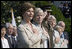 Mrs. Laura Bush stands with Lynne Pace and her husband, Chairman of the Joint Chiefs of Staff General Peter Pace, during the official arrival ceremony for Prime Minister Junichiro Koizumi of Japan on the South Lawn Thursday, June 29, 2006.