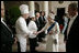 Her Majesty Queen Elizabeth II is joined by President George W. Bush as she thanks members of the White House staff at the conclusion of the State Dinner in her honor Monday, May 7, 2007. White House photo by Eric Draper