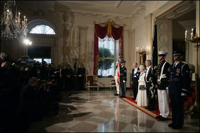 President George W. Bush and Mrs. Laura Bush pause for media photos with Her Majesty Queen Elizabeth II and His Royal Highness The Prince Philip, Duke of Edinburgh, in the Grand Foyer of the White House Monday, May 7, 2007, prior to attending a State Dinner in the Queen’s honor. White House photo by Shealah Craighead