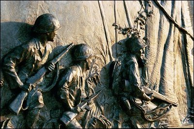 Soldiers engaged in jungle warfare are depicted in a bronze bas-relief sculpture panel on the Southern balustrade of the memorial.s ceremonial entrance wall. Twenty-four bas-relief panels were created by sculptor Ray Kaskey for the Memorial. Many panels are based on photographs from World War II.