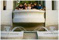 A group of young people tours the Pacific Theater Memorial Pavilion located on the southern side of the memorial. 