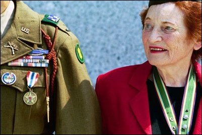 A veteran of the Battle of the Bulge and the Army Nurse Corps, Dorothy S. Davis of Kensington, Md., visits the memorial with fellow veterans. 