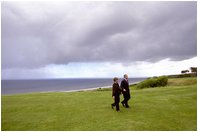 President and Laura Bush mark the memory of America and the Allied Forces' D-Day Invasion during a visit to Omaha Beach at Normandy, France, May 27, 2002. More than 5,000 ships and 12,000 planes carried troops across the English Channel into battle in which the Allied Forces suffered more than 9,000 casualties. The victory in this epic battle was the key to the Allies' victory in the war.