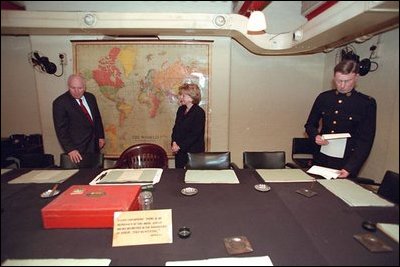 Vice President Dick Cheney and Lynne Cheney tour Winston Churchill's Cabinet War Room in London March 11, 2002. Sitting at the center chair in this underground bunker, Prime Minister Churchill met with his advisors and commanded England's forces. Shortly after Pearl Harbor, the Prime Minister took a risky journey to meet with President Roosevelt in Washington, D.C., and address Congress Dec. 26, 1941. The two leaders worked closely throughout the war, often in secret, to coordinate Allied Forces.