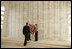 President Bush lays a wreath at the USS Arizona Memorial at Pearl Harbor Oct. 23, 2003. The memorial marks the resting place of 1,177 crewmen who died during the Dec. 7, 1941, attack upon Pearl Harbor. Their names are carved into the marble wall visited by President Bush.