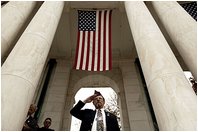 During Veterans Day ceremonies held at the Arlington National Cemetery Nov. 11, 2003, a veteran salutes during President Bush.s remarks. "We observe Veterans Day on an anniversary -- not of a great battle or of the beginning of a war, but of a day when war ended and our nation was again at peace," said the President. "Ever since the Armistice of November the 11th, 1918, this has been a day to remember our debt to all who have worn the uniform of the United States."