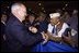 Vice President Dick Cheney greets veterans after addressing the Veterans of Foreign Wars 103rd National Convention in Nashville, Tenn., Aug. 26, 2002. .In the military, you devoted yourselves to a cause above self-interest, served with a firm sense of duty and developed personal standards that make you an example for your families and your fellow citizens. The daughter of an Army Air Corpsman described growing up with her father, and the values she learned from him without even knowing it. As she recalls, .Honesty, integrity, hard work, personal responsibility, and perseverance were all around me and I absorbed them almost imperceptibly.. Our veterans have had a similar effect on the entire nation.. said the Vice President in his remarks. 